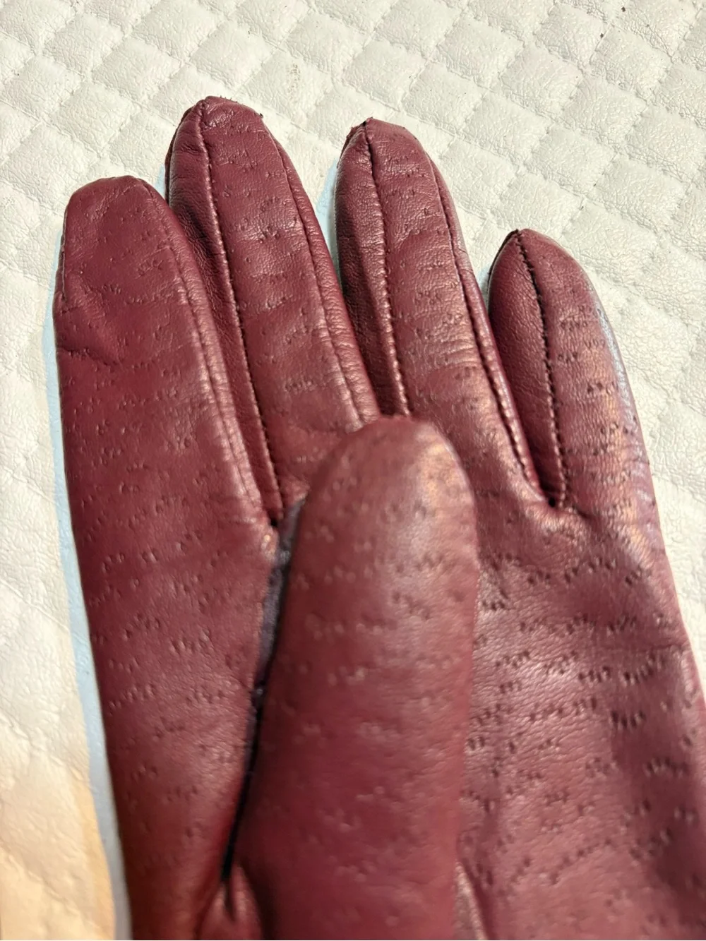 maroon leather gloves feature a distinctive textured perforated pattern 6.5